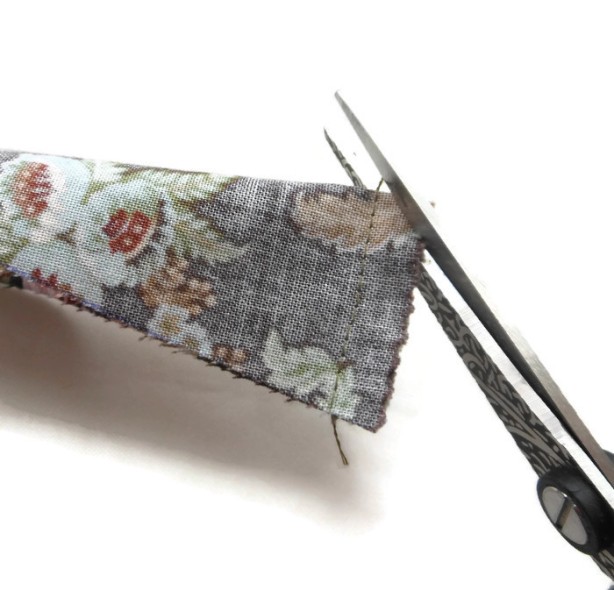 Snip any excess fabric away which could create bulk in the corner - Don't go too close to your stitching!